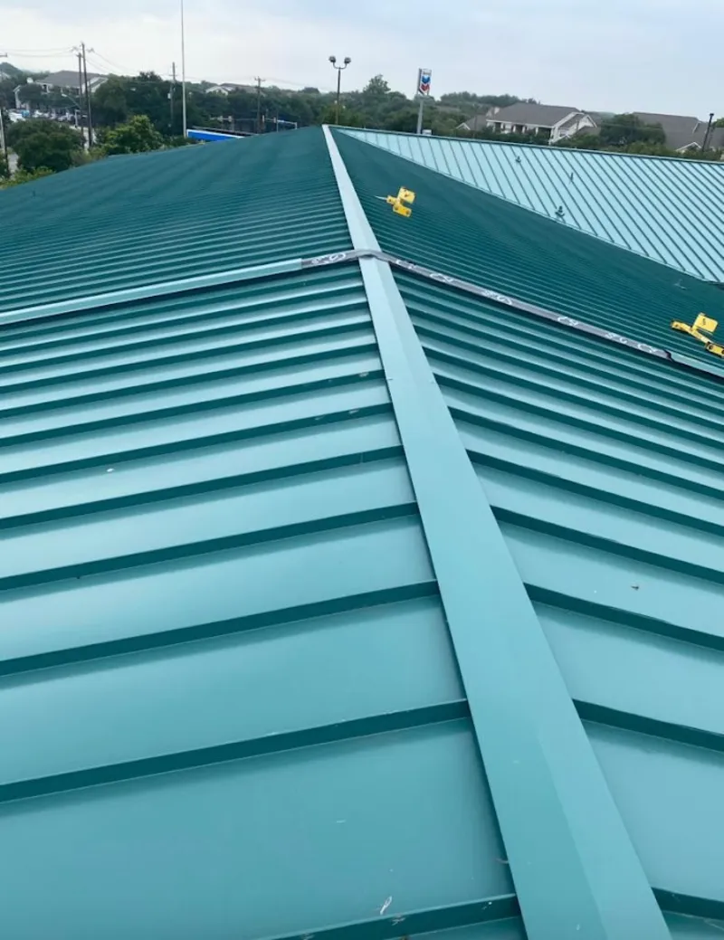 Green commercial metal roof ridge and valley for Metal Roof Repair in North Adams