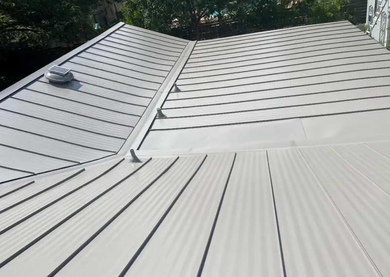 Solar attic fan installed on a metal roof for Roof Ventilation in North Adams